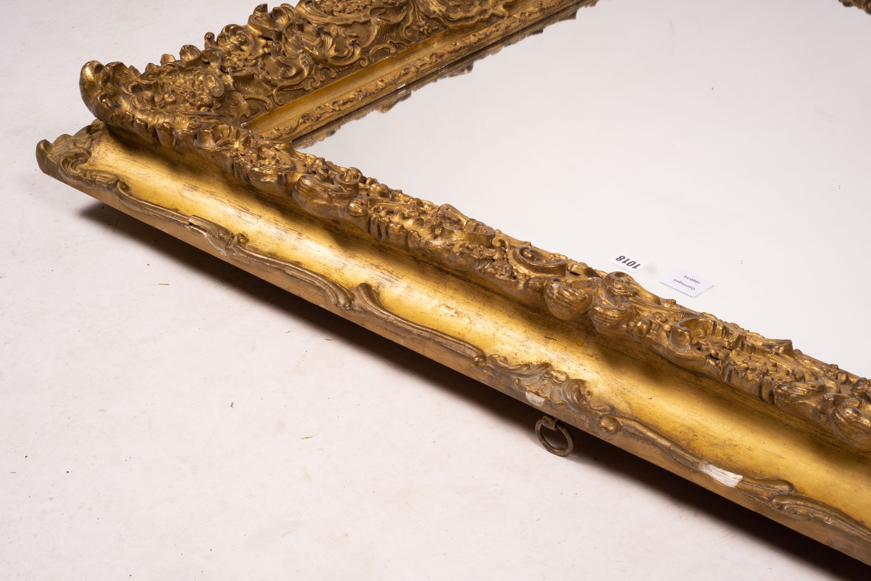 An ornate Victorian giltwood and gesso rectangular wall mirror (formerly a picture frame) width 130cm, height 112cm